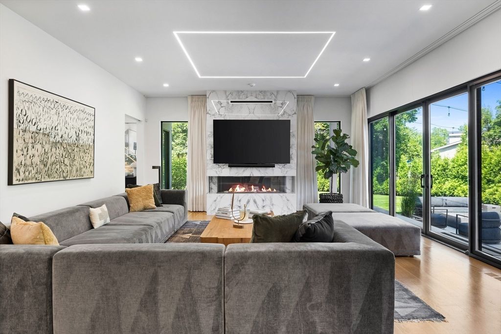 Fireplace, Interior, Living room, Marble Walls, Recessed Lighting, Wood Texture Flooring