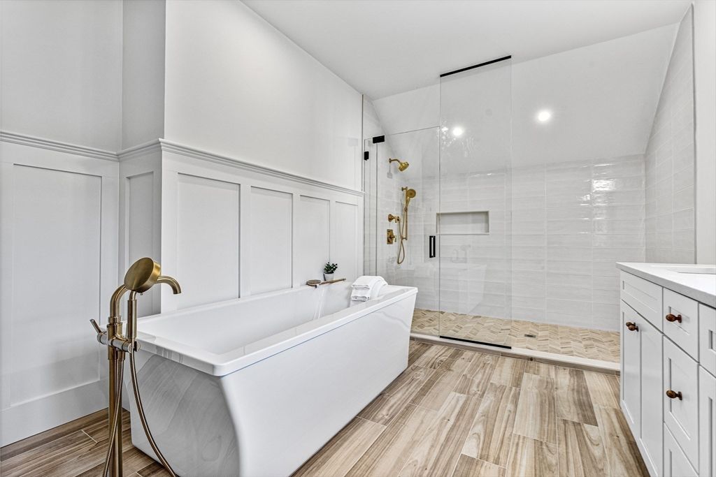 Bathroom, Free Standing Baths, Glass Shower, Interior, Recessed Lighting, Wood Texture Flooring