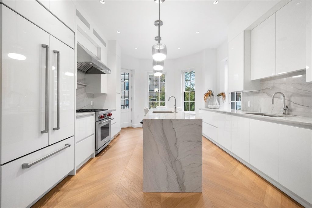 Interior, Kitchen, Marble Walls, Pendant Lights, Recessed Lighting, Stainless Steel Appliances, Wood Texture Flooring