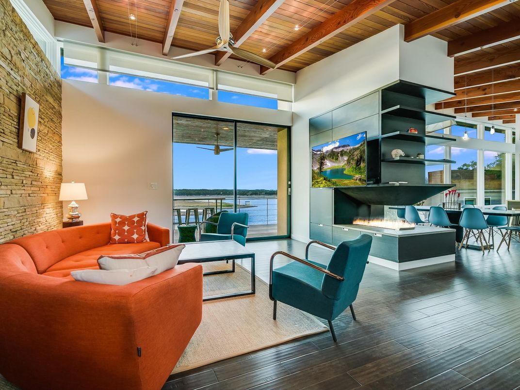 Dining room, Fireplace, Interior, Living room, Recessed Lighting, Stone Walls, Water, Wooden Beams, Wooden Ceilings, Wood Texture Flooring