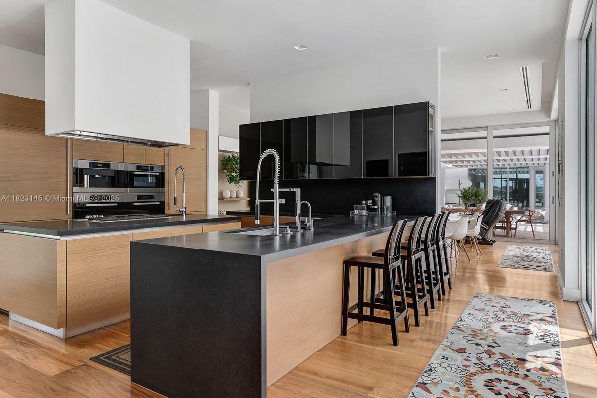 Dining room, Interior, Kitchen, Recessed Lighting, Stainless Steel Appliances, Wood Texture Flooring