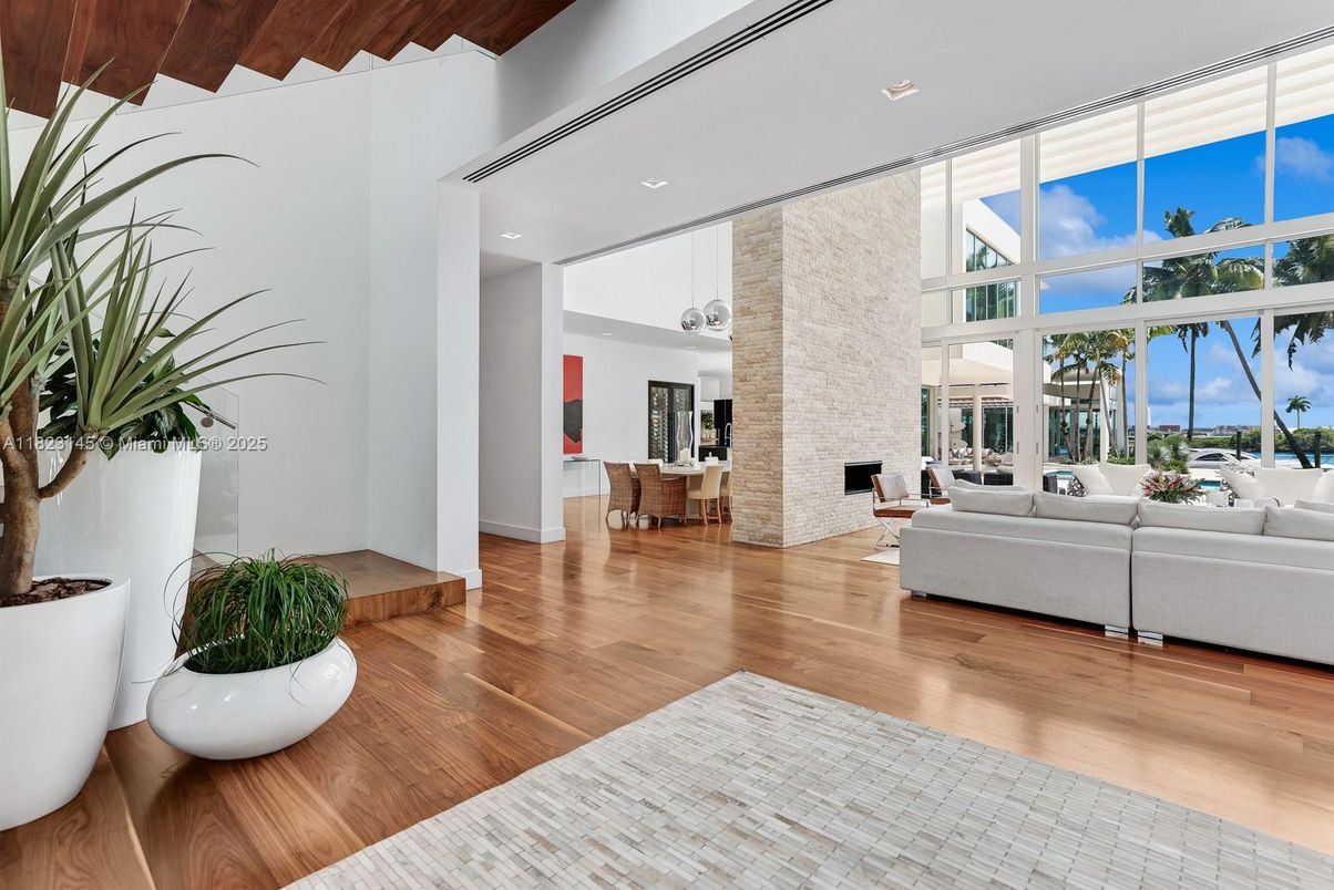 Fireplace, Interior, Living room, Recessed Lighting, Stone Walls, Water, Wood Texture Flooring